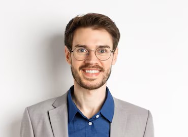 Smiling man with glasses in a suit